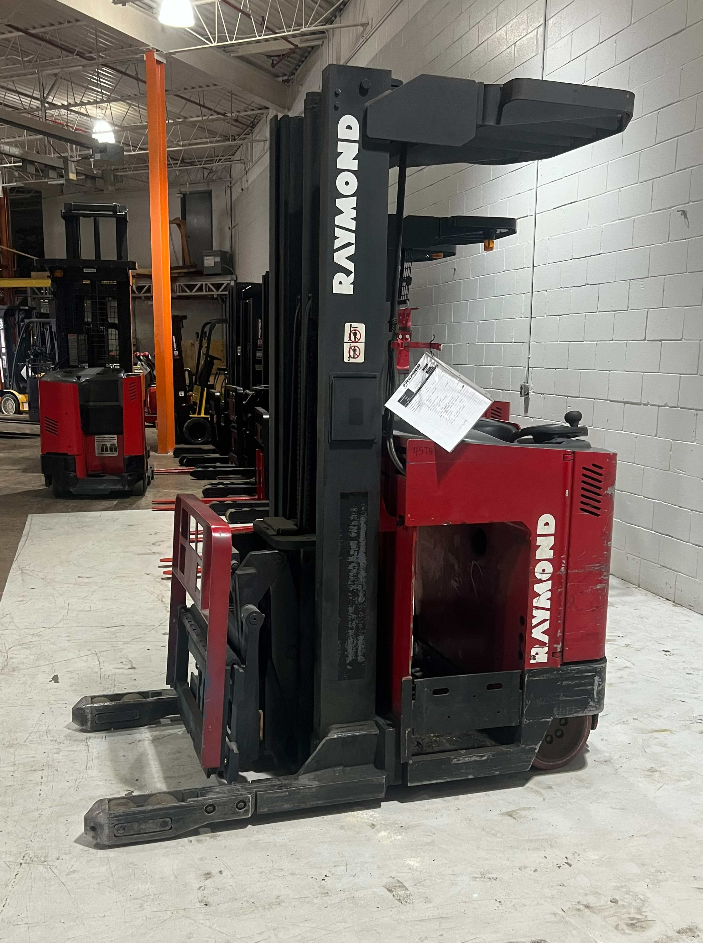 Budget Raymond EASI‑R45TT reach truck, non‑CSA indoor unit, 4,500 lb capacity, 211″ lift height.