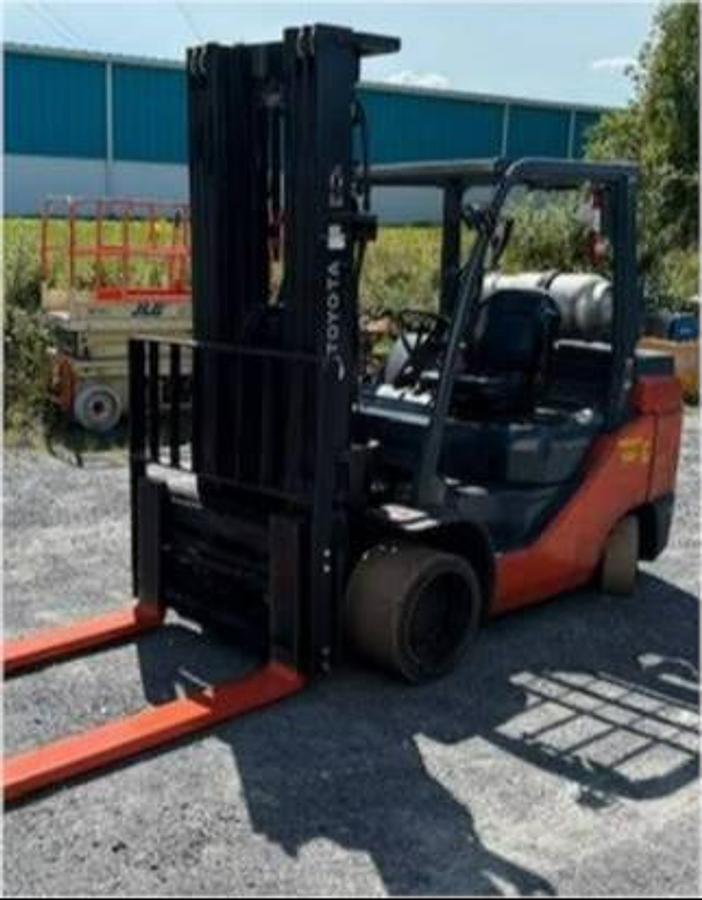 Opposite front side angle view of refurbished 2019 Toyota 8FGC55U-BCS LPG cushion forklift showing 199" triple mast, 48" forks, side shift carriage, and CSA decal during Brampton deployment