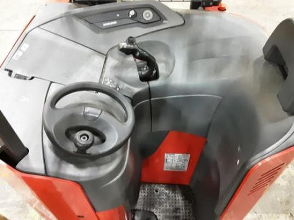 Operator compartment view showing stand-up controls and side-stance layout