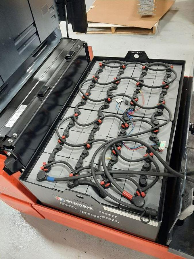 Battery compartment of Toyota 8FBE20U showing 48V battery and charger setup – CSA certified electric forklift in Brampton ON