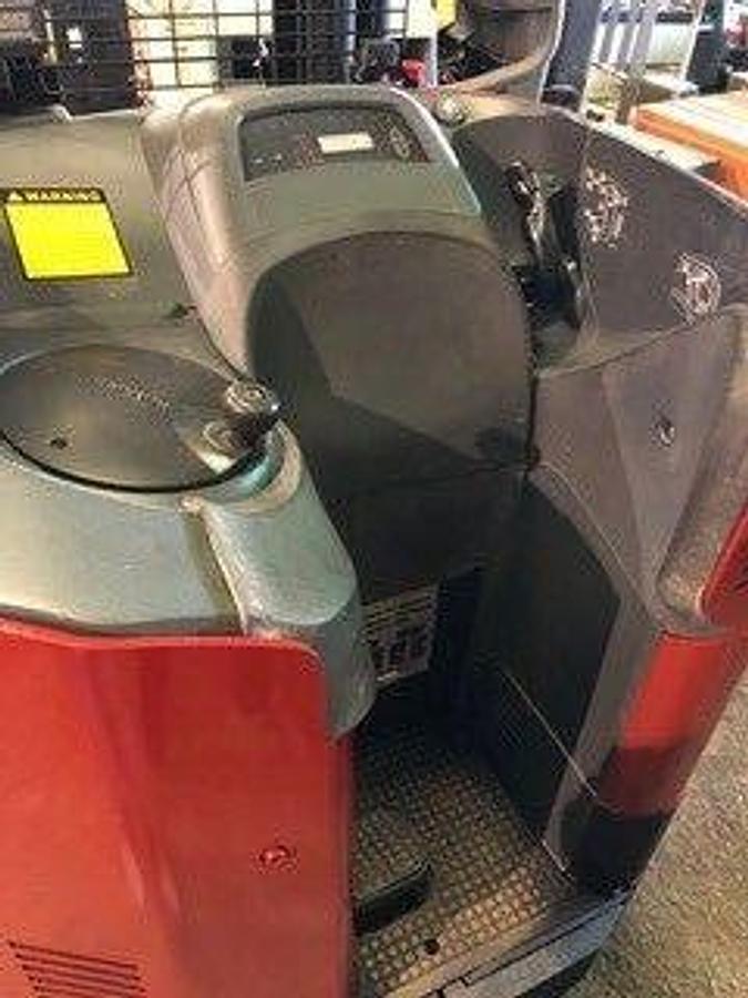 Operator dash of 2008 Raymond 740DR32TT electric deep-reach forklift showing steering wheel, instrument panel, and CSA safety decals during Brampton deployment