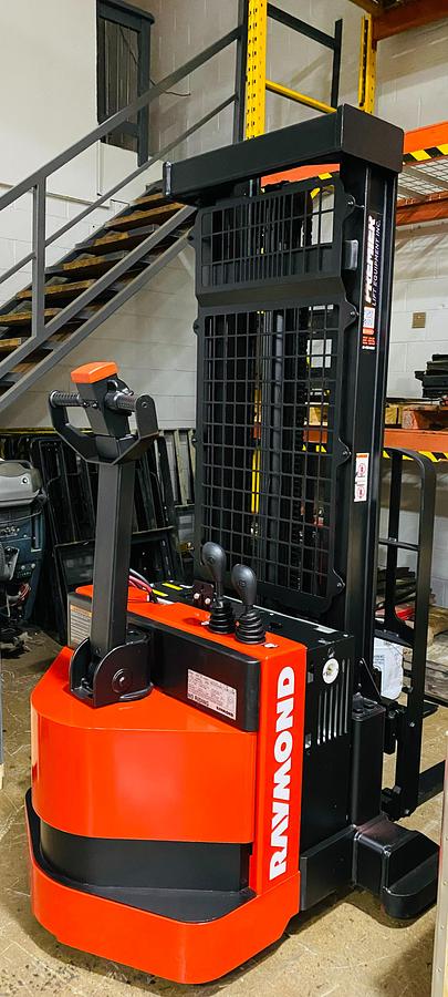"Rear angle view of refurbished Raymond RSS walkie straddle stacker with 24V electric power unit"
