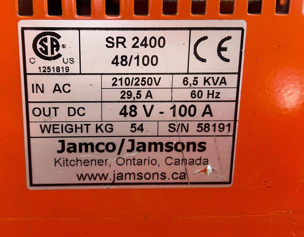 “Jamco charger dataplate showing model SR 2400, serial 58191, 48V 100A output, 210–250V input, CSA and CE markings.”