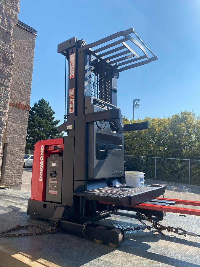 Raymond 560-OPC30TT WG – loaded on flatbed trailer – CSA certified electric order picker in transit – Brampton ON