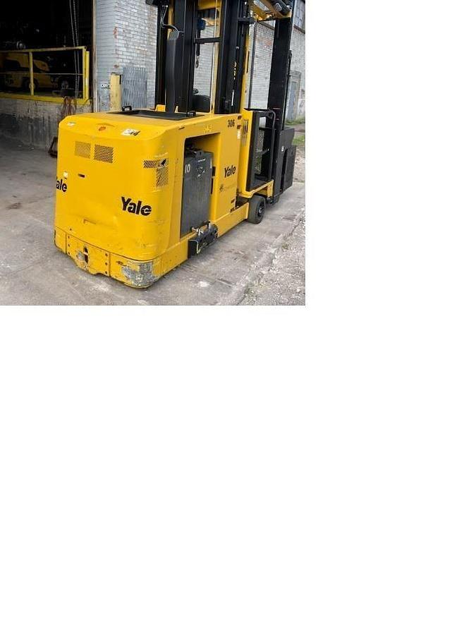 Rear side view of refurbished 2013 Yale NTA030SB electric man‑up swing reach turret truck showing counterweight, rear chassis, and safety lighting during Ontario deployment.