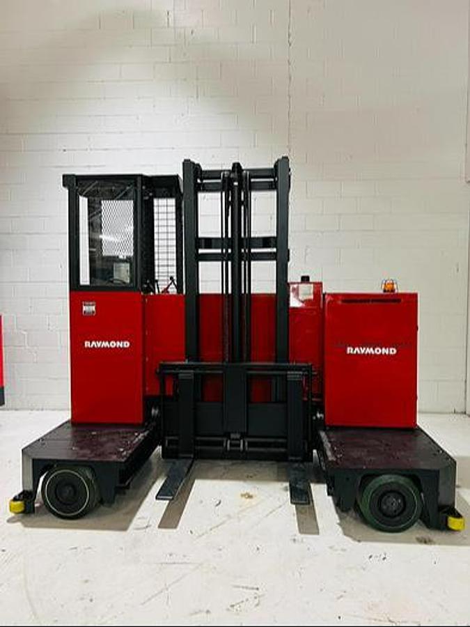 Front view of 1998 Raymond SL60TN electric sideloader – CSA-certified 6,000 lb unit with 233” mast, 30” deck, and adjustable fork carriage shown fully reconditioned and freshly painted in Brampton ON – Premier Lift Equipment
