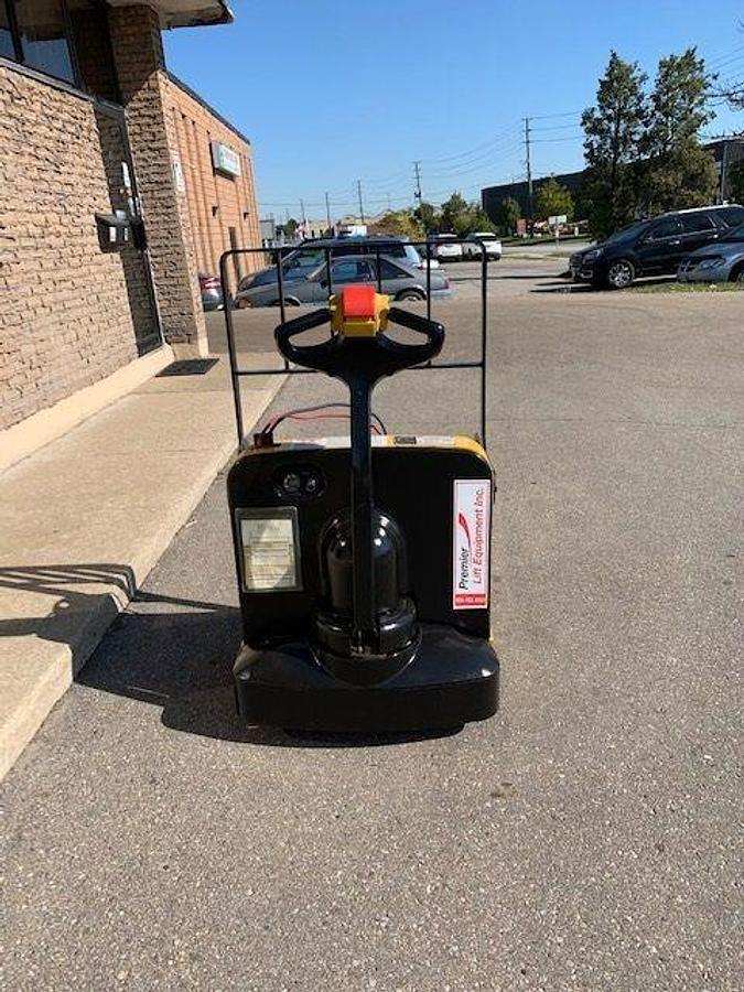 Back view of refurbished 2010 Yale MPB040 electric walkie pallet jack showing operator handle, rear wheels, and CSA certification decal during Ontario deployment