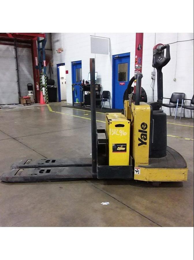 Opposite side view of refurbished 2014 Yale MPB060 electric walkie pallet jack showing battery pack, hydraulic lines, and CSA decal during Ontario deployment