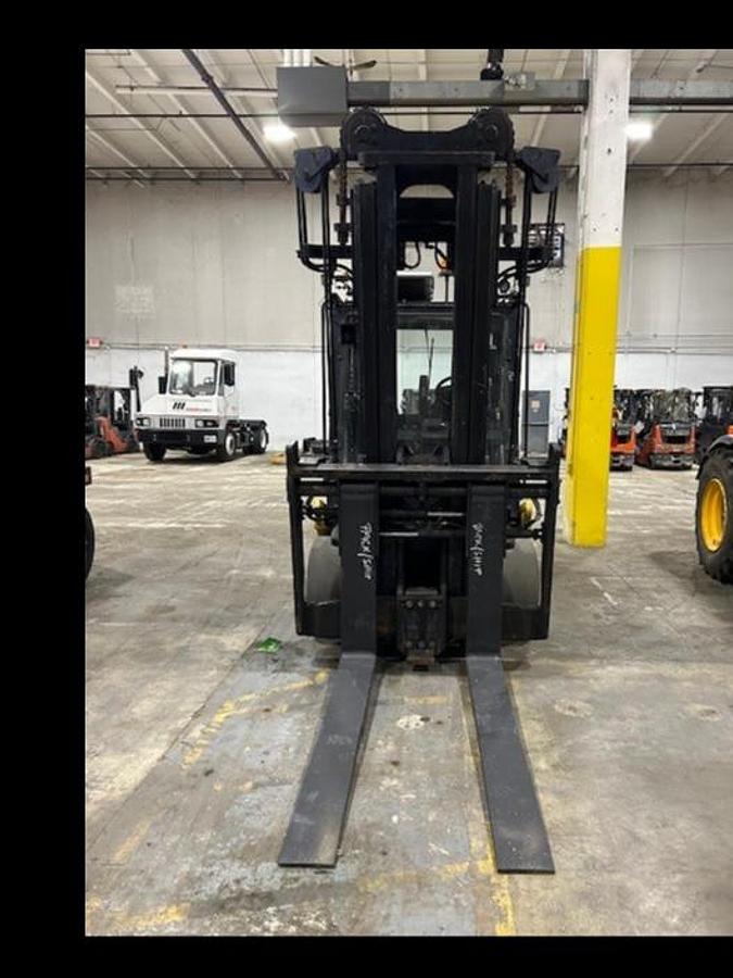 Front view of Taylor TH-C300C ultra high-capacity cushion tire forklift – CSA-certified 30,000 lb chassis showing 66” forks with fork positioner, Ultra-VU mast, overhead guard, and full cab with A/C staged in Brampton ON – Premier Lift Equipment