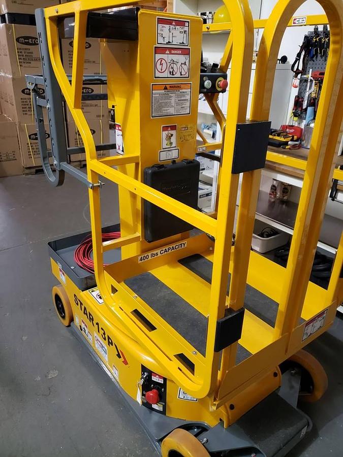 Back angled side view showing counterweight and rear wheels