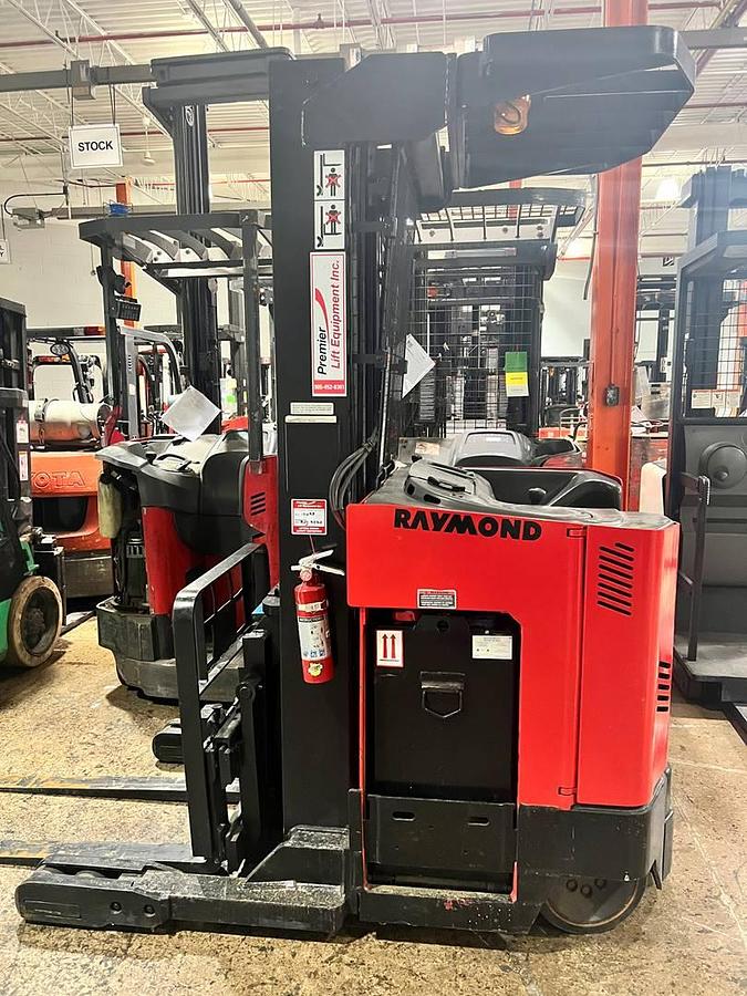 Refurbished 2006 Raymond EAISR40TT electric reach truck with CSA certification and new paint deployed in Mississauga for narrow aisle warehouse operations