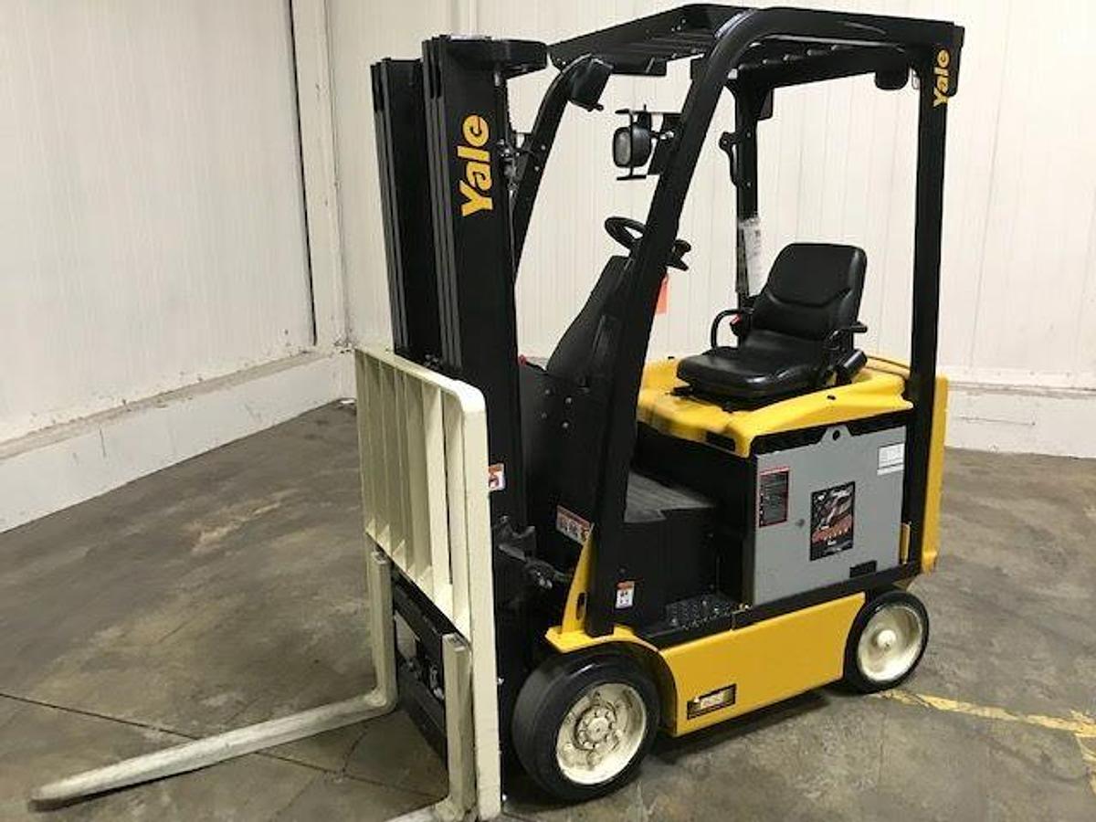 Opposite front side view of refurbished 2017 Yale ERC040VAN electric forklift showing mast, forks, operator cab, and cushion tire chassis during Brampton deployment