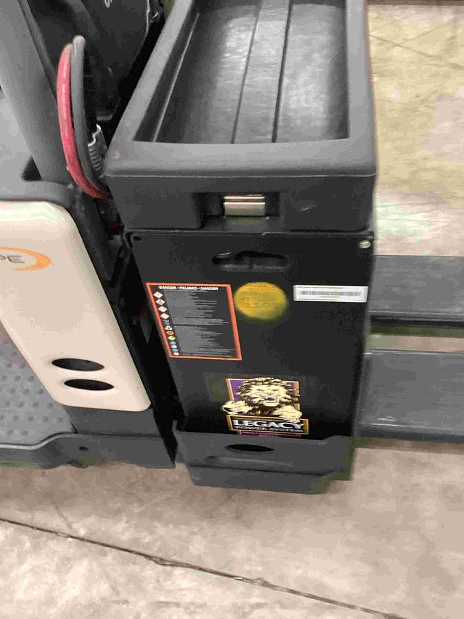 Battery compartment of Crown PE4500 showing 24V industrial battery bay and clean internal components.