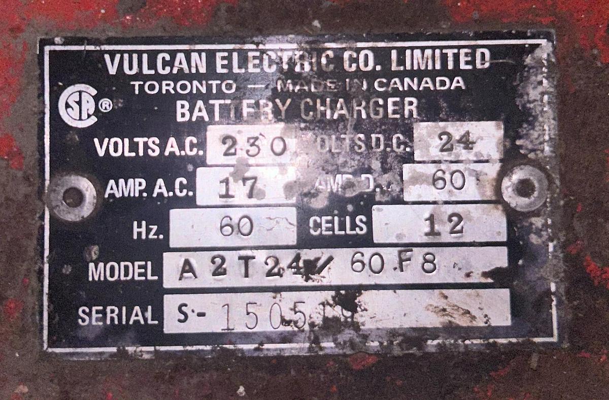 “Vulcan charger dataplate showing model A2T24 60F8, serial S‑1505, 24V 60A output, 12‑cell lead‑acid specs, and 230V single‑phase input.”