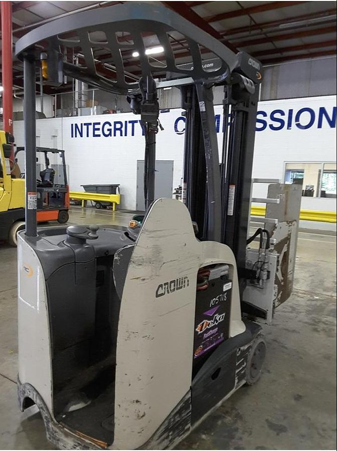 Rear side view of refurbished 2013 Crown RC5545‑40 electric forklift showing rear chassis, 36 volt battery compartment, and CSA certification decal during Ontario deployment.