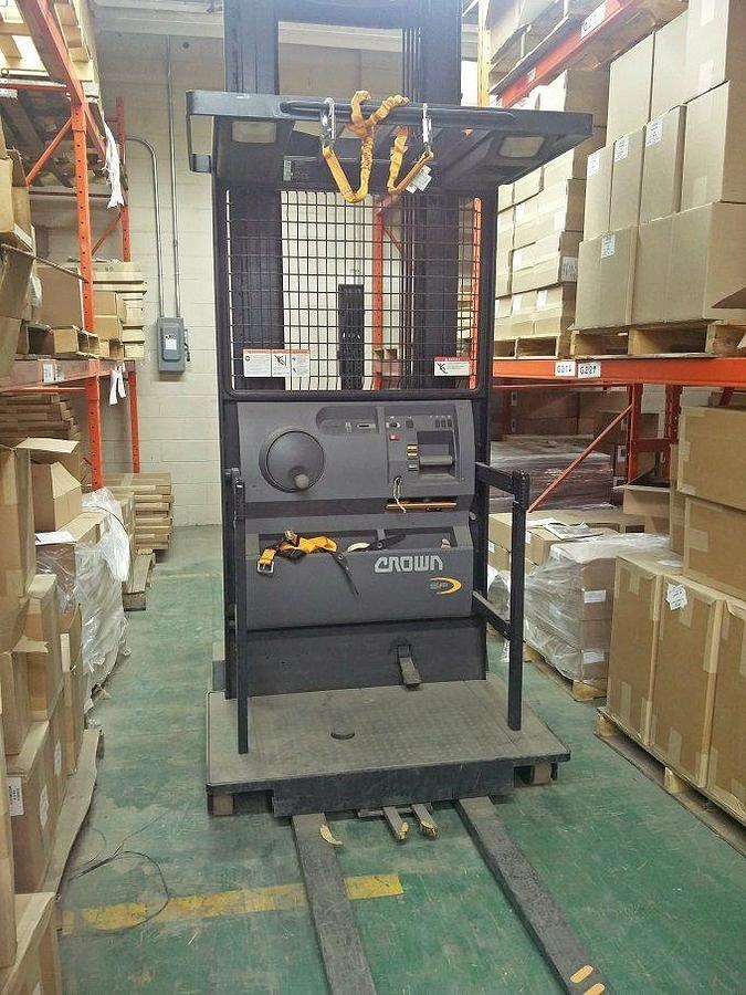 Front view of refurbished 2007 Crown SP400‑30 electric order picker showing 48" platform, 42" forks, and CSA certification decal during Ontario deployment.