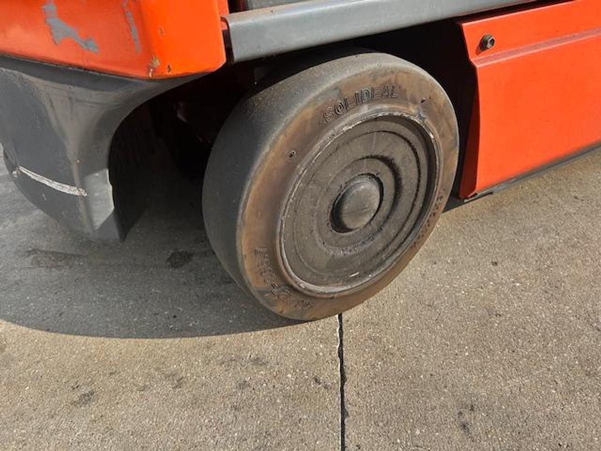 Steer tire view of Toyota 8FBCU25 forklift – rear black cushion tire, CSA-certified electric forklift, indoor