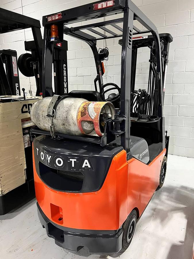 Rear view of refurbished 2007 Toyota 8FGCU15 LP gas forklift showing counterweight, propane tank mount, and CSA inspection tag during Brampton deployment