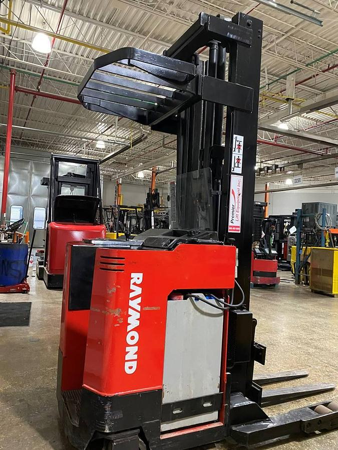 Refurbished 1993 Raymond 31-R45 electric reach truck with CSA certification and new paint deployed in Mississauga for narrow aisle warehouse operations