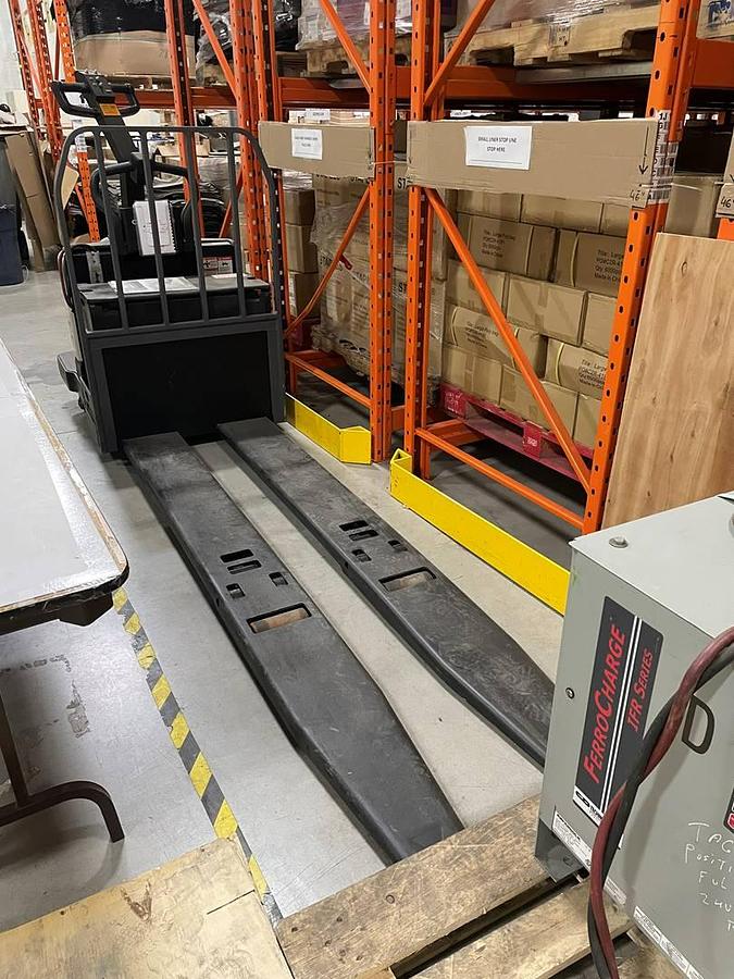 Crown PE4500-80 – front angle view – long forks and fixed rider platform – CSA electric pallet jack – Brampton ON