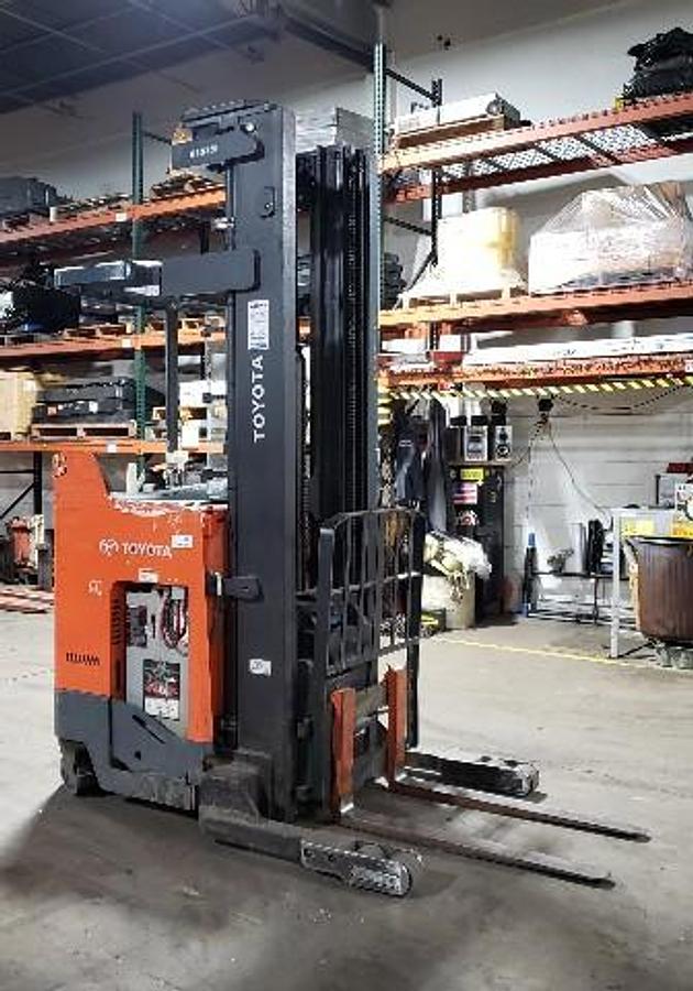 Opposite side profile of Toyota 9BRU18 reach truck showing mast, chassis, and reach assembly