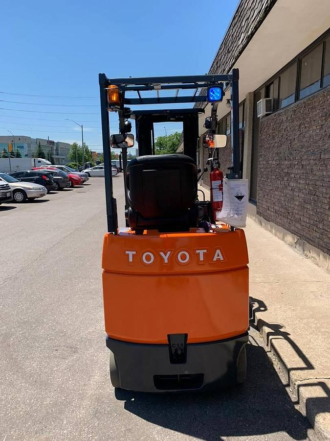 Back view of refurbished 2008 Toyota 7FBCU18 electric 4-wheel sit-down forklift showing counterweight, rear tires, and CSA certification decal during Ontario deployment
