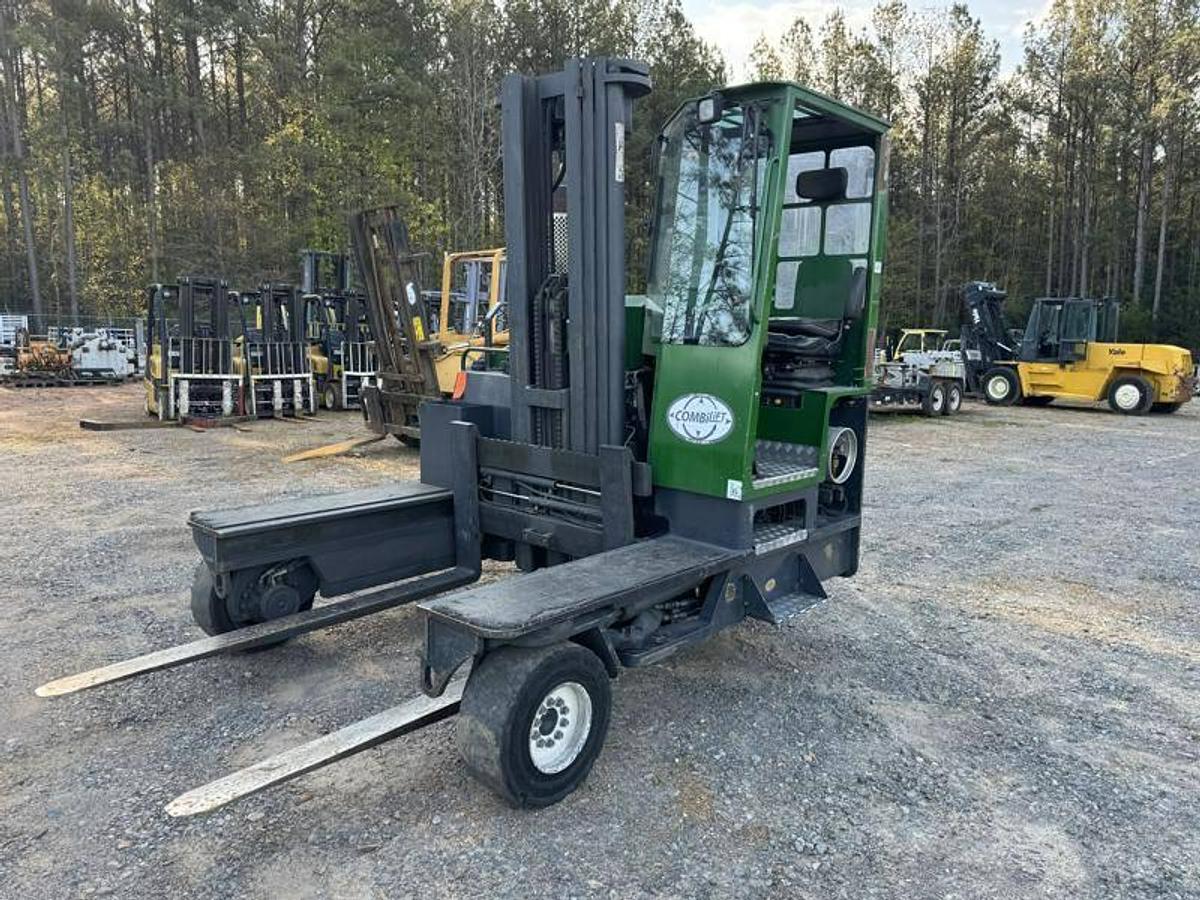 Front angled view of refurbished 2012 Combilift C10000XL LP Gas multi‑directional forklift showing fork positioner, 78" forks, 217" mast, LPG tank, and CSA certification decal during Ontario deployment.