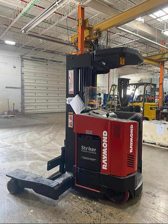 Opposite side view of refurbished Raymond EASI 4D‑R45TT forklift with narrow‑aisle design and CSA compliance