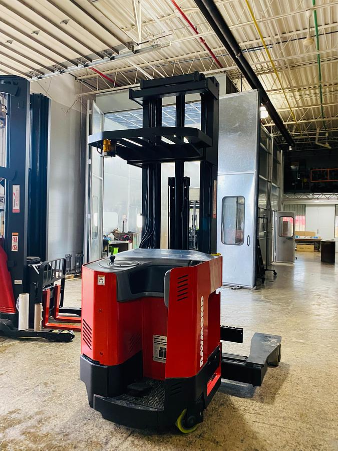 Rear view of Raymond EASI 4D-R45TT reach truck showing counterweight, operator cab, and CSA certification during warehouse deployment