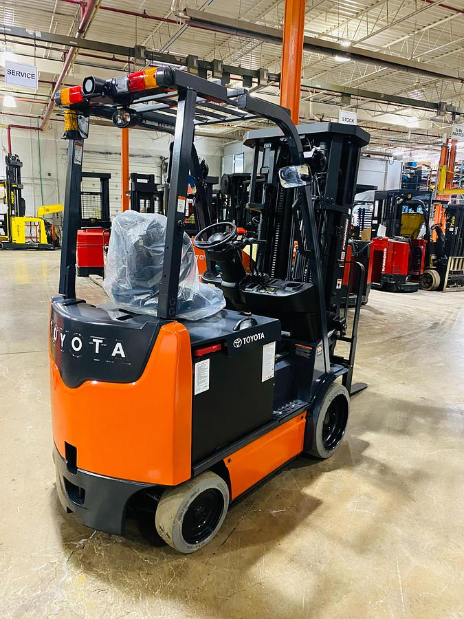 Rear side angle of Toyota 8FBCU25 forklift – CSA-certified electric unit with ergonomic operator compartment, cushion tires, and side-shift carriage – Premier Lift Equipment Brampton ON