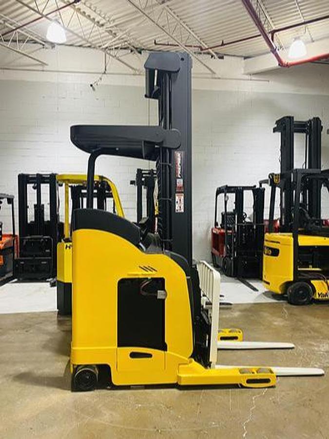 Side view of CSA-certified Yale NR040EANL electric reach truck with triple mast – staged in Brampton ON