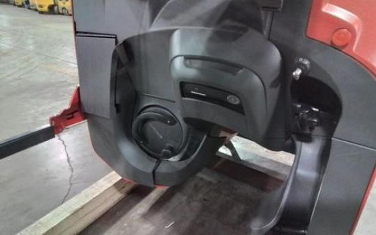 Operator compartment view showing stand-up controls and forward-stance layout