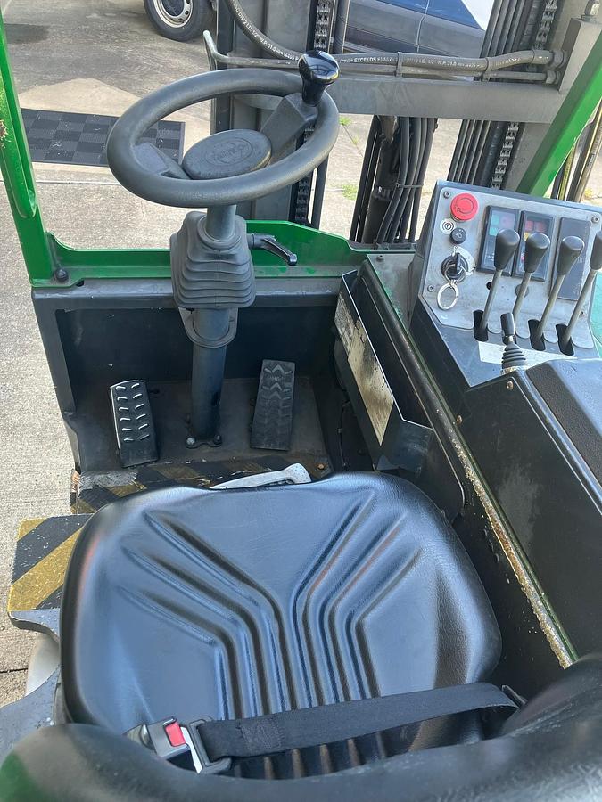 Combilift CB6000 – operator compartment – seat, steering wheel, hydraulic levers, safety decals – propane forklift – Brampton ON