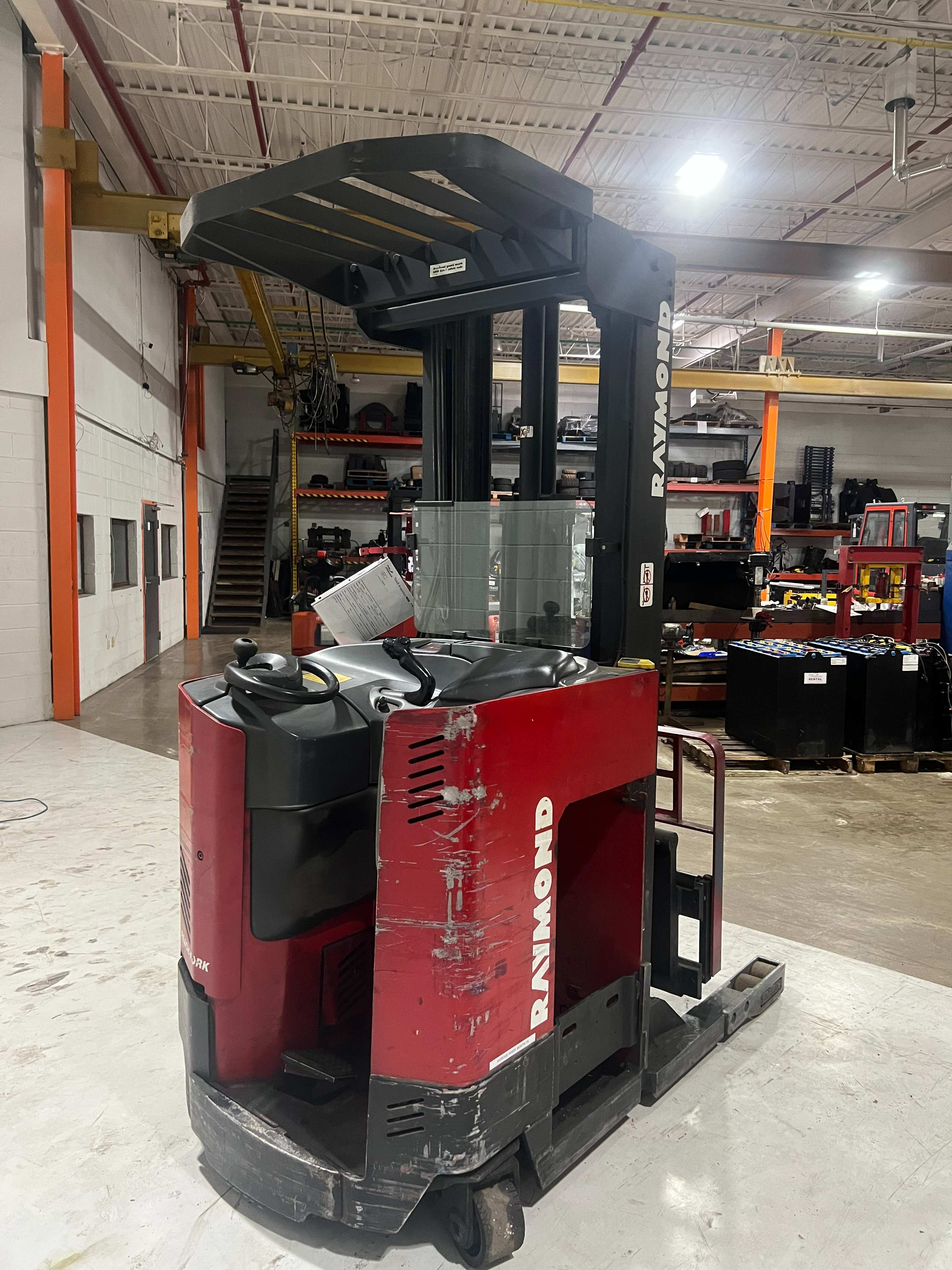 Back View: Counterweight and chassis of Budget Raymond reach truck.