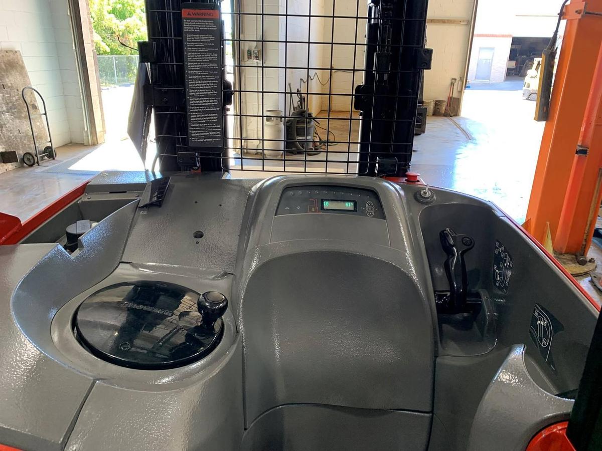 Operator dash of 2019 Raymond 750DR32TT electric deep-reach forklift showing steering wheel, instrument panel, and CSA safety decals during Brampton deployment