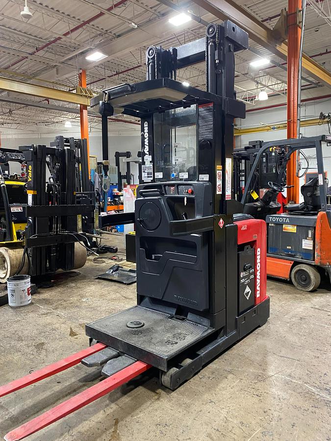 alt="2014 Raymond 560-OPC30TT CSA Certified Electric Order Picker angled front side view, reconditioned, no wire guidance"