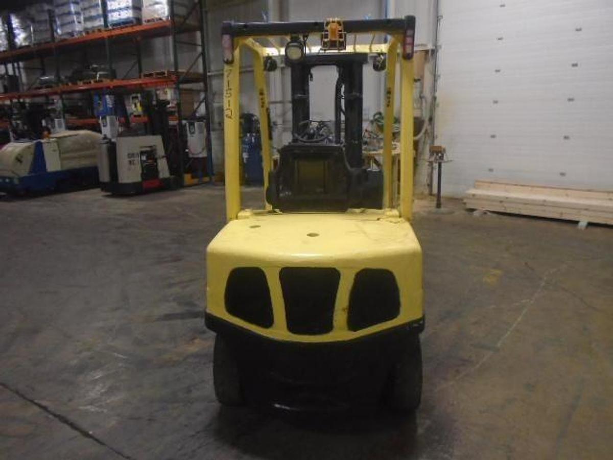 Rear view of refurbished 2006 Hyster H70FT diesel forklift showing counterweight, rear tires, and engine cover during Brampton deployment
