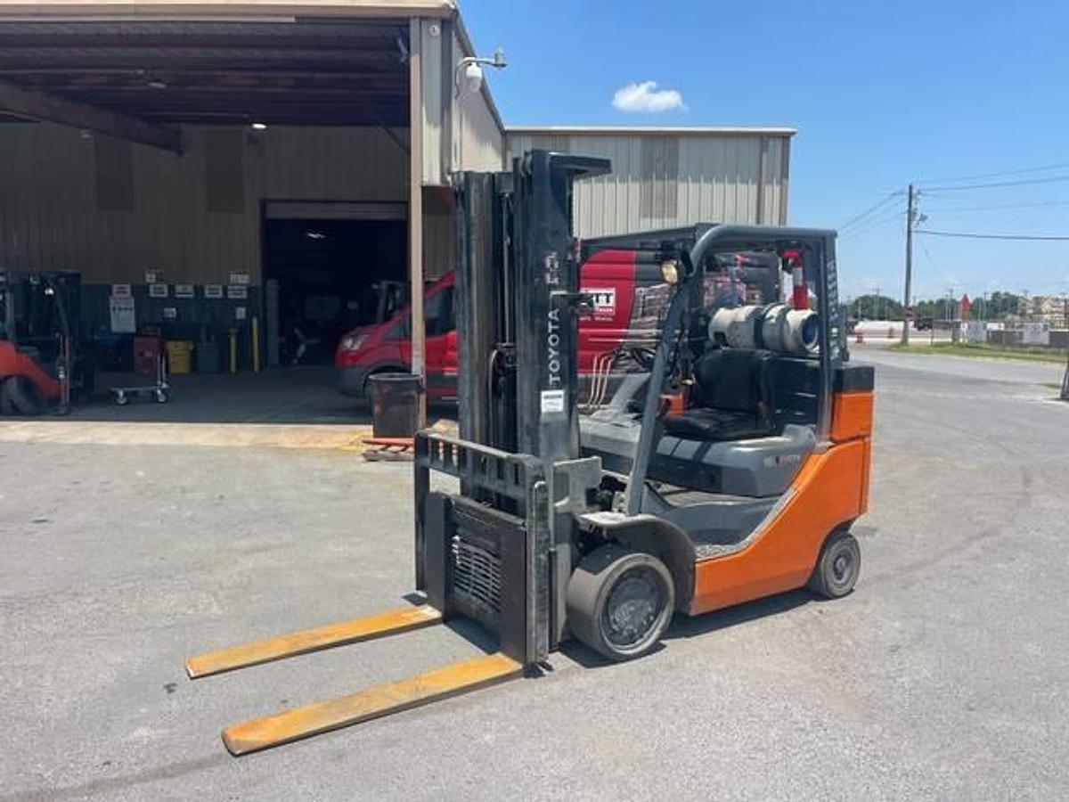 Front side view of refurbished 2016 Toyota 8FGC35U-BCS LPG cushion forklift showing boxcar special chassis, 199" triple mast, 46" forks, and CSA decal during Brampton deployment
