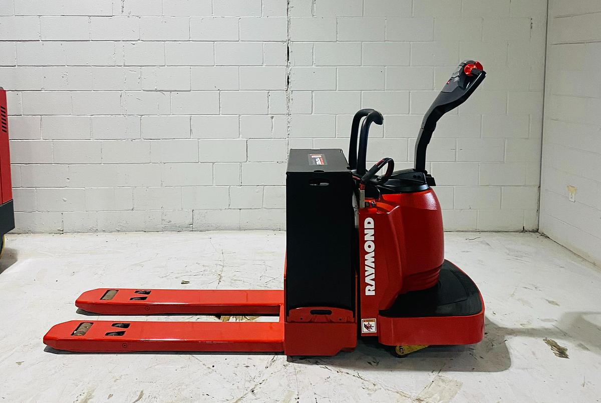 Budget Raymond 8400 ride‑on walkie — 6,000 lb capacity, 27×48 forks, 24V electric.