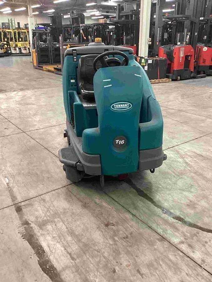 2018 Tennant T16 ride‑on scrubber rear view – recovery tank, squeegee assembly, industrial warehouse cleaning machine
