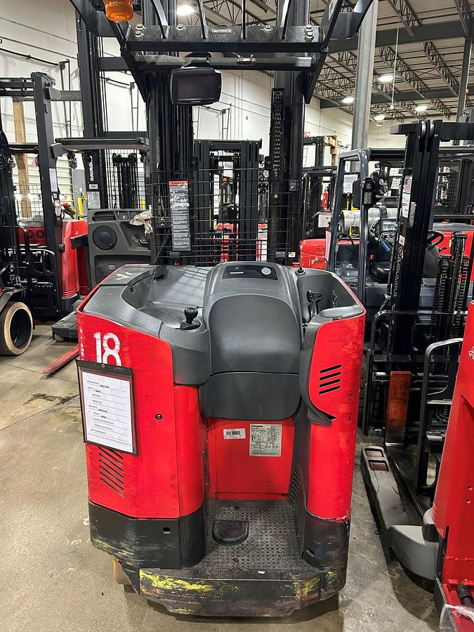 Operator compartment view showing stand-up controls and ergonomic handle