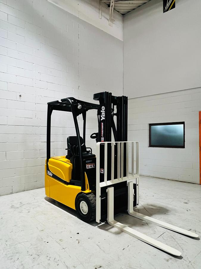 Front side angle view of 2018 Yale ERP030VTN electric forklift – CSA-certified 3,000 lb 3-wheel chassis with triple mast, side shift, and cushion tires shown refurbished and sold chassis-only – safety-tagged in Brampton ON – Premier Lift Equipment