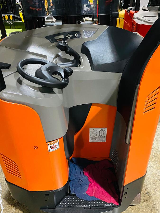 Operator compartment view showing stand-up controls and side-stance layout