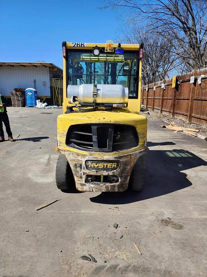 Back view of refurbished 2017 Hyster H80FT LP Gas forklift showing counterweight, rear tires, and CSA certification decal during Ontario deployment.