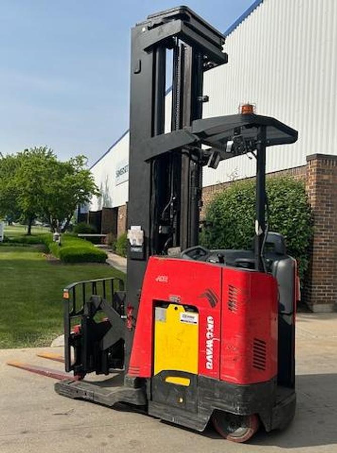 Opposite side view of 2020 Raymond 750-R45TT electric reach truck shown chassis only without battery or charger – CSA-certified 4,500 lb unit featuring 301” triple mast, ergonomic stand-up operator compartment, poly cushion tires, and 36V AC chassis staged in Brampton ON; battery and charger available separately as extra options new or used – Premier Lift Equipment