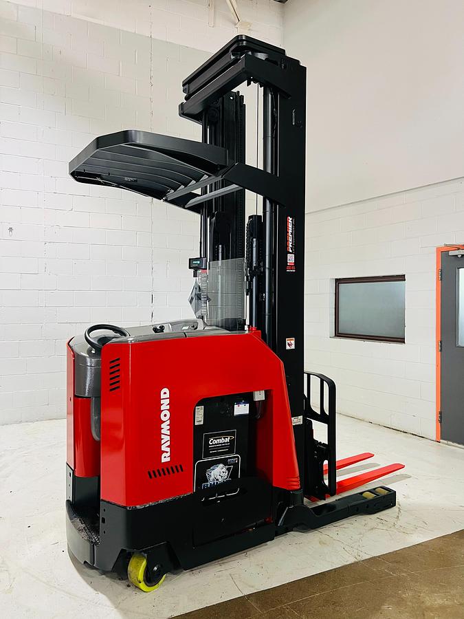 Side profile of Raymond 750DR32TT electric deep-reach forklift showing extended mast rails, reach mechanism, and chassis layout during Brampton deployment