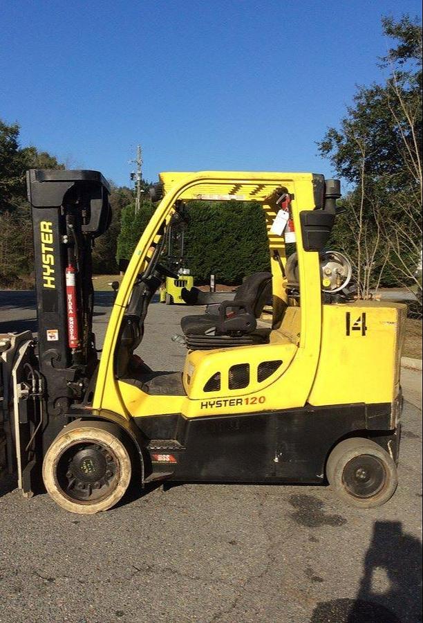 Side profile of 2013 Hyster S120FT LPG cushion forklift showing mast rails, chassis layout, and indoor tires during Brampton deployment