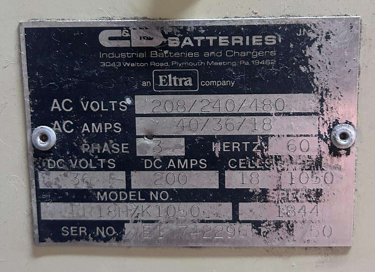 “C&D charger dataplate showing model 18H1050E3, serial 7422996, 18V 106A output, 10‑cell lead‑acid specs, and 208/240/480V single‑phase input.”