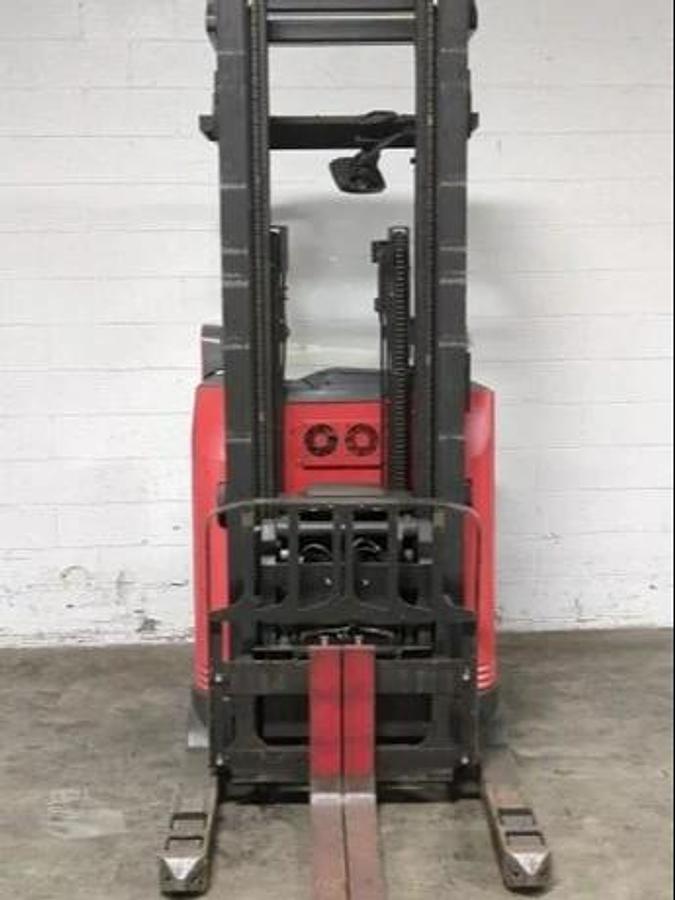 Front view of 2019 Raymond 750-DR32TT electric reach truck – CSA-certified 3,200 lb chassis with triple mast and pantograph reach carriage shown refurbished and sold chassis-only, forks lowered and carriage centered for narrow-aisle deployment – safety-tagged in Brampton ON – Premier Lift Equipment