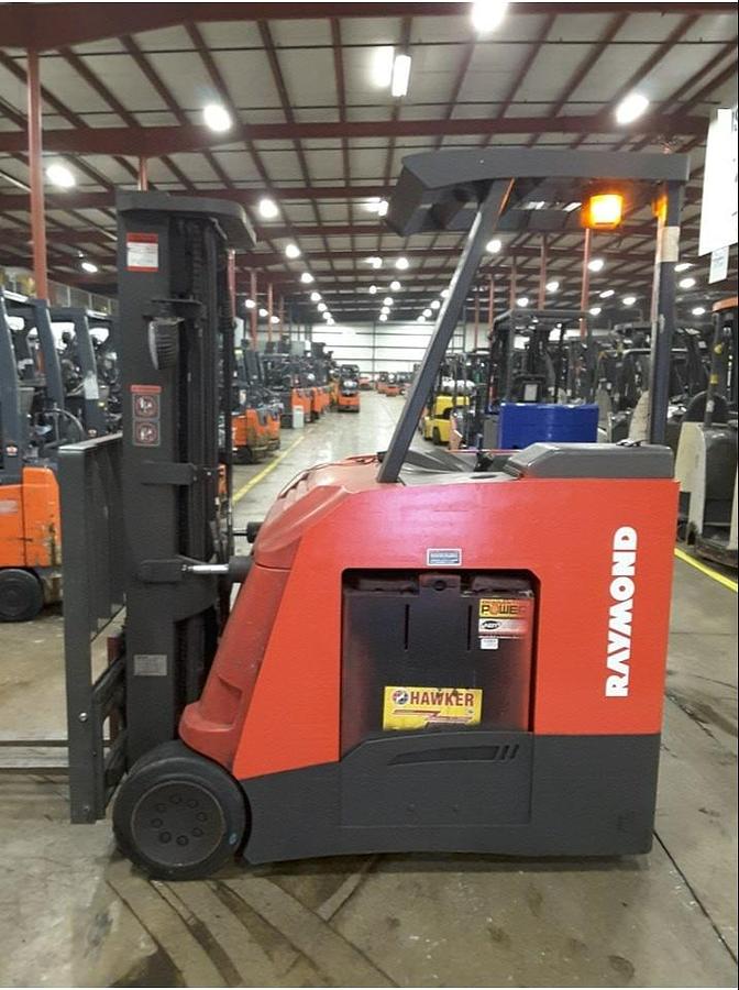 Opposite side view of refurbished 2011 Raymond 425-C50TT electric docker showing reach mechanism, drive unit cover, and chassis structure during Concord deployment